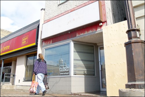 Pedestrians walk by the former Hong Kong restaurant shortly after its March 30, 2013 closure.