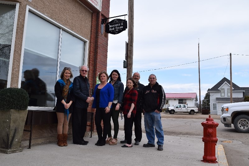 Russell Bartko, of the Canora Economic Development Commission (CEDC), congratulated Brooke Kowalyshyn, Community Insurance Inc. office co-manager, on winning an award for continued excellence in business exterior, and the sign that goes with it. From left, standing under the sign, are Brandi Zavislak, CEDC; Bartko, Kowalyshyn, Jodie Kowalyshyn, Community Insurance Inc. office co-manager; Kylee Toffan, Community Insurance Inc. employee; Dana Antonovich, CEDC; and Al Babb, CEDC. Absent from the picture were Jeff Bisschop, CEDC, and Kerry Trask, CEDC.