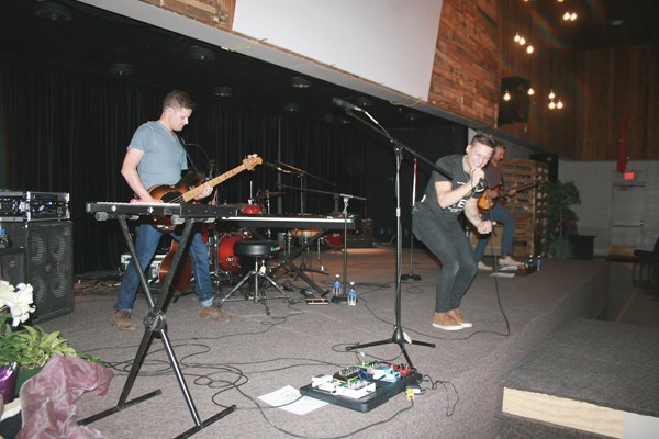 Jon and Crystal Tieszen ( Backyard BLVD), left opened for Flood the Stone, above, during a concert in Yorkton last week at Prairie Harvest Christian Life Centre.