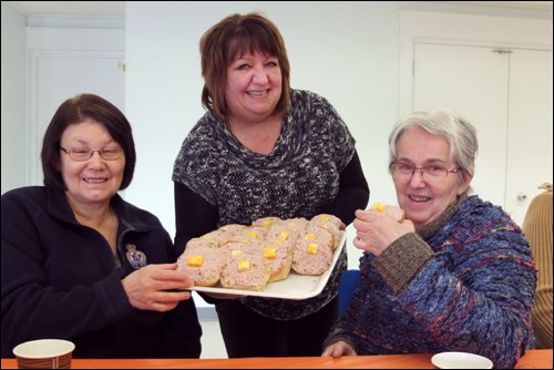 Northern Health Region volunteer coordinator Alvera Koop (middle) served bunwiches to Margaret Highfield (left) and Janice Ballard at the NHR’s volunteer appreciation luncheon on Monday, April 24 at St. Ann’s Hall. NHR chief executive officer Helga Bryant told guests that volunteers contributed over 1,100 hours to the health care system this past year. - PHOTO BY JONATHON NAYLOR