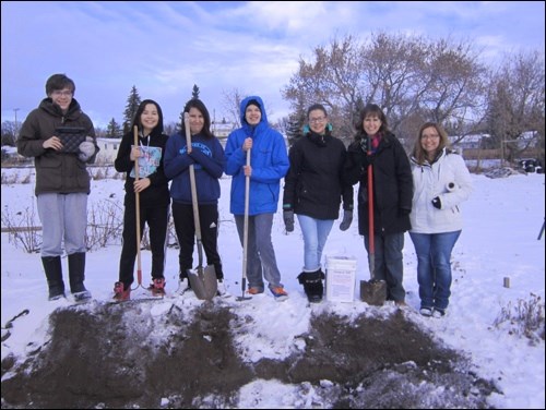 The Bokashi composting group from JP with the first pail of fermented organic matter to add to the community garden plot on Gagne Avenue. Photos submitted