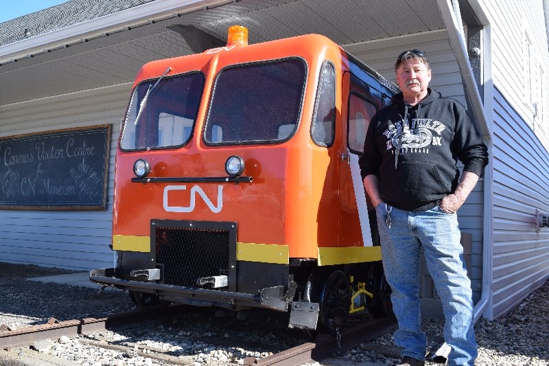 Randy Danyluk, labourer, Town of Canora, shows off the antique CN motor car which he restored.