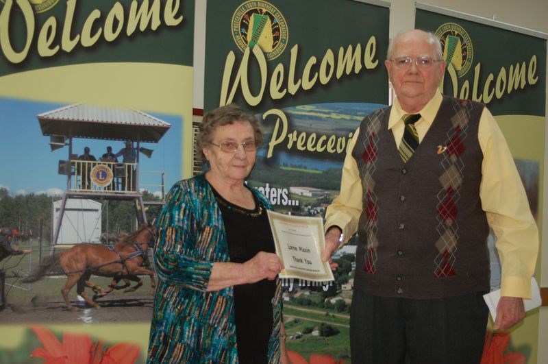 Mary Petrowski presented Lorne Plaxin with a special certificate for his dedication as a volunteer to the Preeceville and District Heritage Museum.