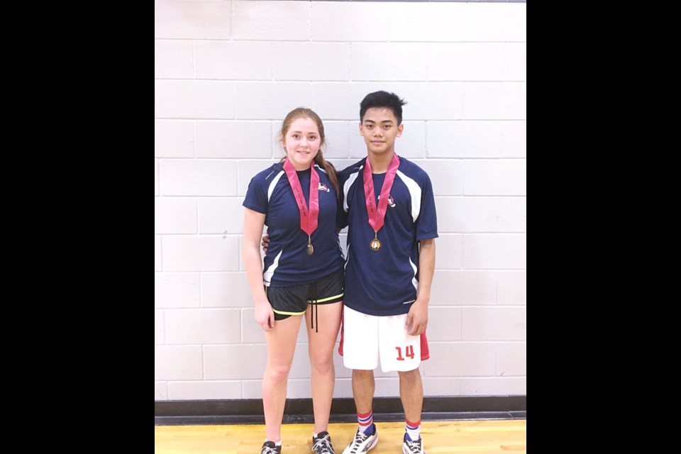Sammy Wade and John Sasi won gold in mixed doubles to advance to regionals. Photo submitted