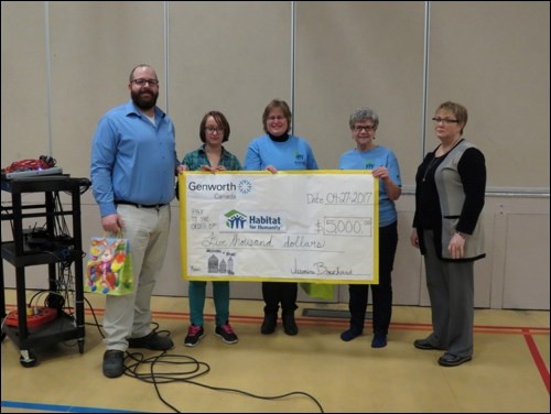 Jasmine Bouchard presents the local chapter of Habitat for Humanity (Cathy Richardson and Nadine Parohl) with a cheque in the amount of $5000. Photos submitted