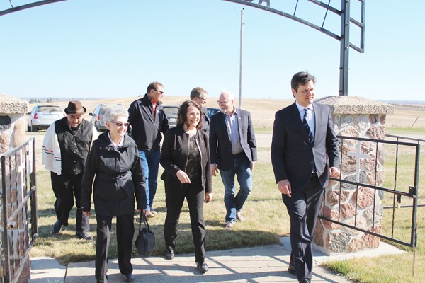 Ambassador Bálint Ódor arrives at the Kaposvar Historical Site along with Yorkton-Melville MP Cathay Wagantall and her husband and an entourage of local Hungarian-Canadians.