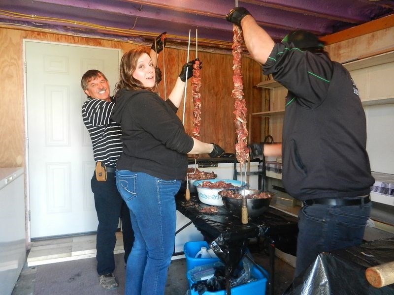 At work skewering the lamb and chicken meat for shishliki, from left, were: Leo Lucash, Lynn Matwijeczko and Murray Verigin.