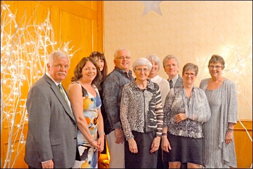 Catholic Family Services board members and staff, from left to right, Ken Loehndorf, president; Sand
