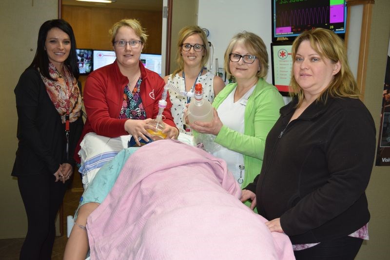 STARS Air Ambulance flight nurses provided Canora Hospital staff with practise in various medical situations inside the STARS mobile education unit. Taking part in the simulation, from left, were: Denise Treleaven, STARS flight nurse and lead instructor; Megan Walker, Canora nurse; Cathie Drackett, STARS flight nurse; Donna McCormick, Canora nurse and Lisa Prokopetz, Canora nurse.