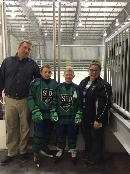 Selects Hockey Development team members Cameron Allard of Kamsack, centre left, and Chase Hembling of Canora, centre right, were photographed last week with John McDermott, head coach, and wife Donna Allen of Carlyle.