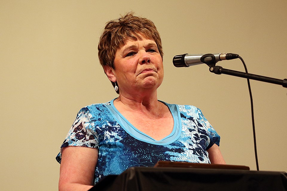 Elaine Ernst gives a quick acceptance speech after receiving the Citizen of the Year award.