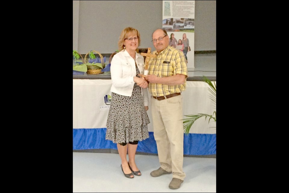 Lumen Christi Award to Kathy Jones, presented by Gerald Beres. Photos by John Cairns
