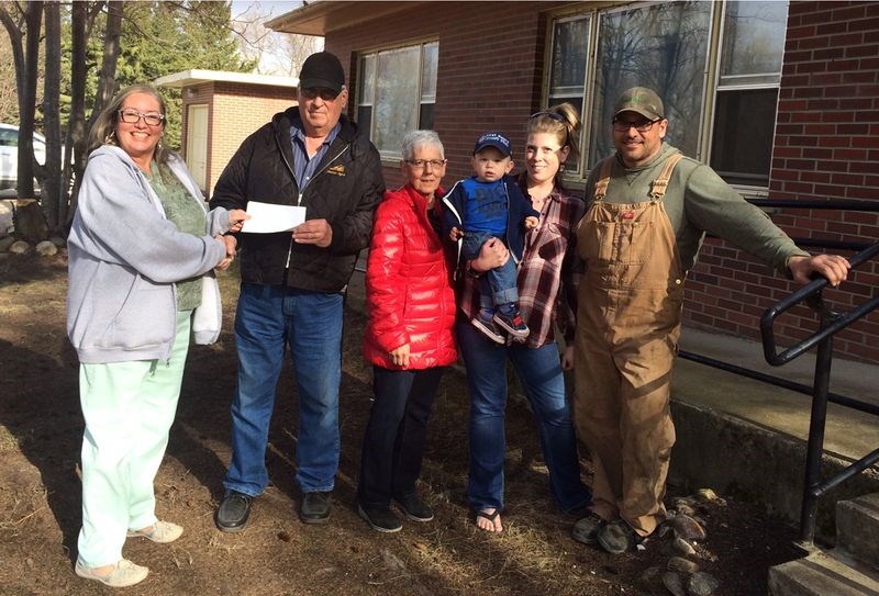 Garry and Troy Moroz and families from Pelly presented cheque of $20,000 for a donated canola crop. Yvonne Hotzak, president of the Fort Pelly-Livingstone Museum board, received the cheque on behalf of the museum.