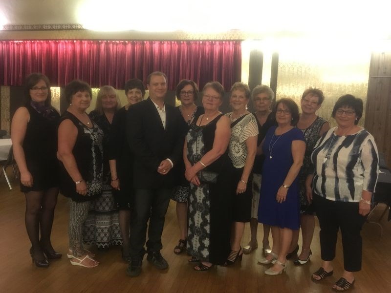 Hypnotist Jamie James provided entertainment for the Canora Wheatland Lioness Ladies Night on May 27. With James, from left, were: Lioness members Shawna Leson, Bev Fransishyn, Val Morozoff, Dodie Litowitz, James (hypnotist), Nancy Leson, Sharon Ciesielski, Darlene Senkow, Bernice Wilgosh, Gladys Tomski, Julia Westerman and Cynthia Gazdewich. Absent from the photo was Karen Wishlow.