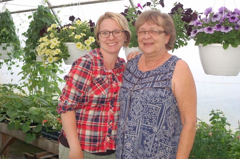 Lorissa Petras, left, recently purchased the Prairie Garden Greenhouse in Ketchen from Fay Aberts. The greenhouse will be moved and relocated to Hazel Dell.