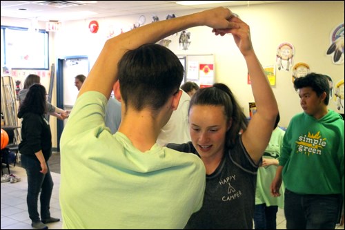 Bea Levine and Daniel Muchinsky learned how to square dance at the Flin Flon Aboriginal Friendship Centre last month. The teens, part of a travelling choir from Brandon, participated in one of the ongoing square dancing workshops taught by Nigel McCallum.