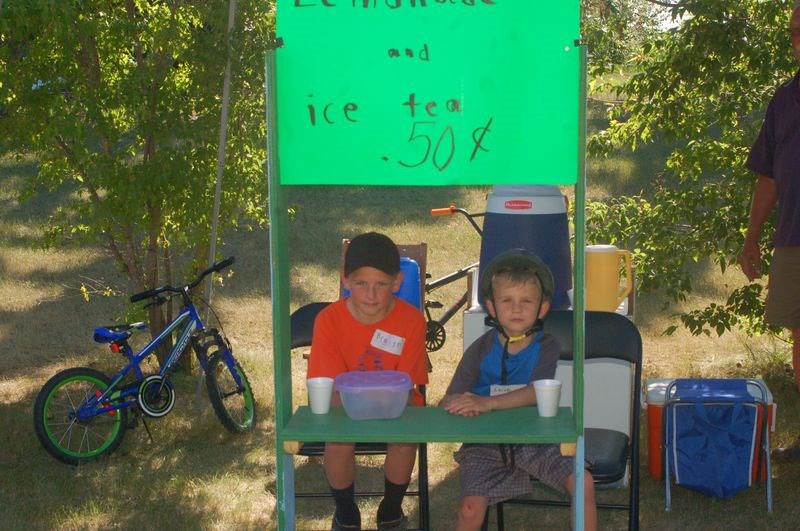 Bracyn Konkel, left, and Keltyn Konkel sold iced tea and lemonade at the Sturgis Station House Canada 150 celebrations.