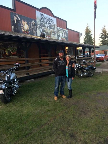 Dawson and Kristen Ramsay stopped for a photo in front of Rawhides on June 24. They are the owners of Ramsay Health and Fitness and organizers of the RHF Bike Rally.