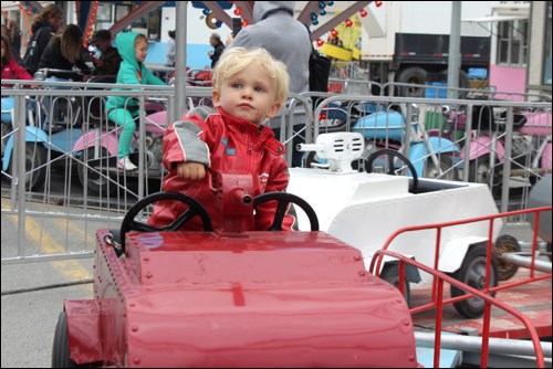 Hunter Larsen enjoyed one of the Main Street Days rides. - PHOTO BY ERIC WESTHAVER