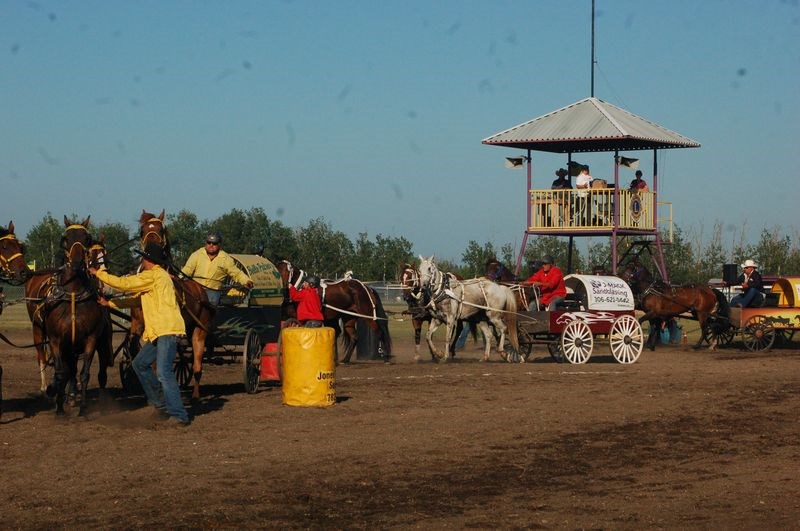 Curtis Longman, left, Kevin Gareau and Ryan Peterson were all very eager to get started in the chuckwagon races.