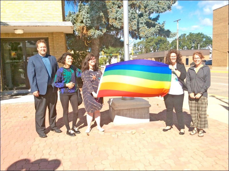 Mayor Ryan Bater, Pilar Waters, Kay Lynne Collier, her mother Erin Woytiuk, and Kelly Waters were on hand at City Hall for the start of Battlefords Pride Week. Bater read the proclamation of Pride Week and the Pride flag was then raised up the flagpole at City Hall.