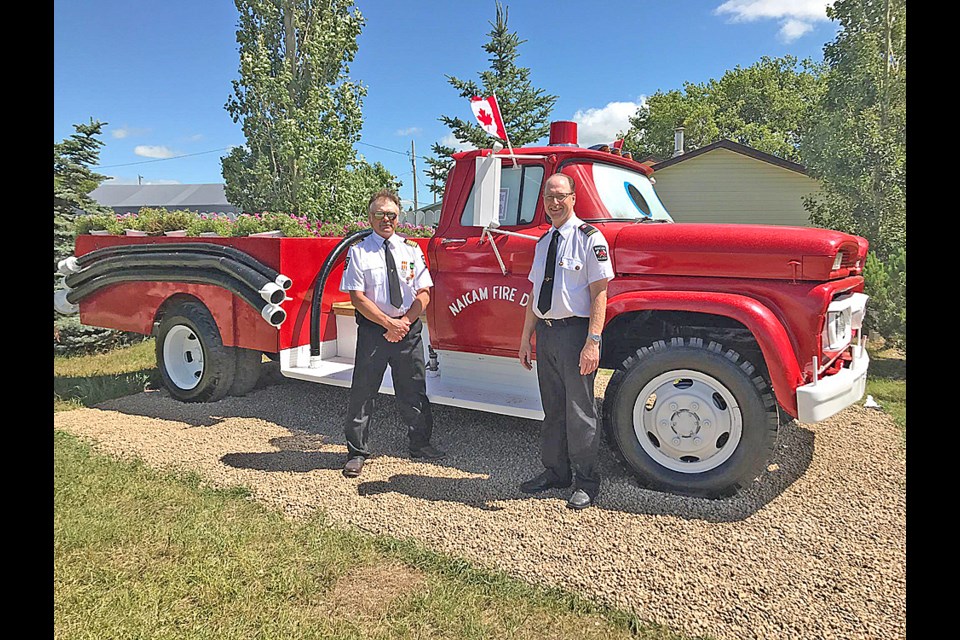 Carl Peterson and Rodger Hayward (pictured, left to right) pose with Naicam’s new addition, a currently nameless new fire truck planter located near the Naicam sign. Tammy Riel with the Naicam Communities in Bloom committee said the National competition judges enjoyed this full new addition while they were on their town tour on July 24. Submitted Photo/Mary Jane Gagnon (CiB - Nationals 2)
