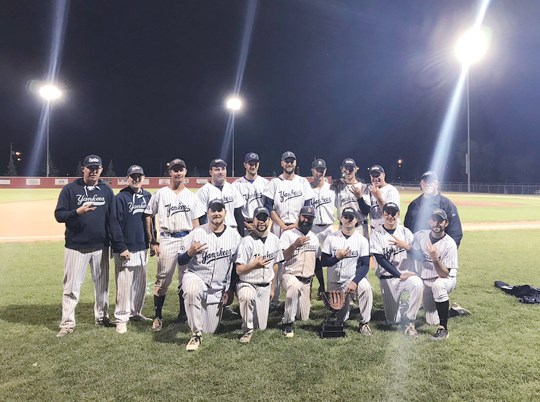 The Yorkton Yankees pose after winning their trophy, holding up “3” symbols to represent their third consecutive league championship. Photo from Twitter.