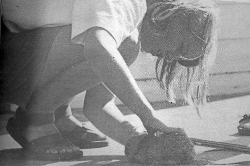 Shown here is Stacey Hooper taking a look at one entry at the pet show at the Golburn Fair. This cutie is ‘Bugsy,’ Robert Fraser’s pet bunny, who went on to win the competition. Tisdale Recorder File Photo