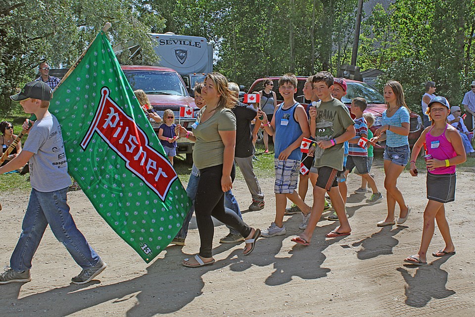 A group of children march in the McKague Reunion parade. The last parade in the hamlet is thought to be have been in the 1980s. Review Photo/Devan C. Tasa