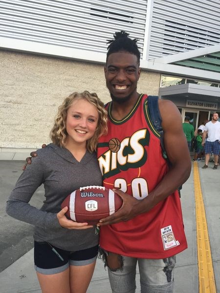 Duron Carter, Saskatchewan Roughrider, posed for a picture with Paige Hansen of Sturgis.