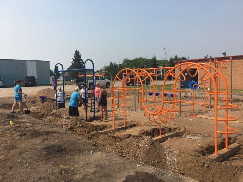 The community of Sturgis rallied to help prepare the groundwork and install new playground equipment for elementary school students. New playground equipment was installed recently, prior to the new school season when the Sturgis elementary and high school students will be attending a combined Kindergarten-to-Grade 12 school.