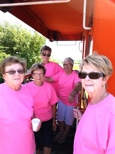 Volunteers, who were on hand to help serve refreshments at the Strawberry Social on July 26, were easy to spot by their pink T-shirts. Standing on the step of the CN caboose, which served as the headquarters for the group during the fundraising event, from left, were: Eileen Chutskoff, Stella Sych, Cathy Cooper, Ruth Dixon and Audrey Horkoff. Horkoff has been a member of the Trackside Gardens group for 17 years, and said the group is all volunteers, with no formal executive. “We are happy to see the excellent turn-out for this event,” she said. “We thank the community very much for the support. We will be using the proceeds to purchase more annuals and perennials for the garden. We are always looking for more volunteers.”