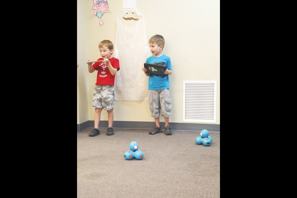 Mason Andrade and Landon Fleury program the robot Dash as part of the Yorkton Public Library’s Dot and Dash activity day. The kids were able to tell the robots where to go and teach them to cheer with the other kids in the program. The goal of Dot and Dash is to teach kids about programming and make it fun for them to learn.