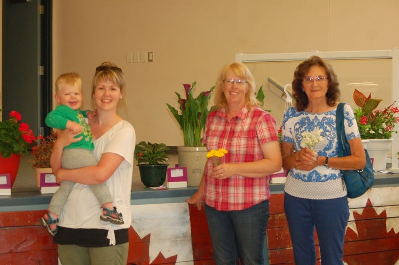The Prestie family supported one another in the Sturgis Horticultural show. From left, were: Will, Leah, Elizabeth and Eileen Prestie. Both Elizabeth and Eileen had entries in the show.