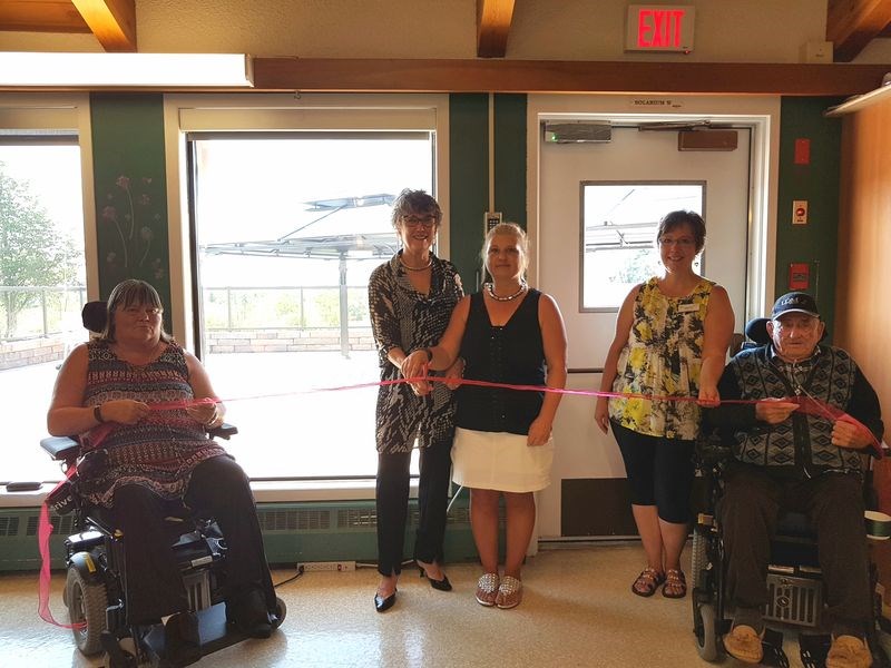 A ribbon was cut to signify the completion and grand opening of the outdoor patio and gazebos known as the Horizon Project at the KDNH on August 1. From left were: Laurie Ducheminsky, resident; Myrna Dey, auxiliary member; Karen Rubletz, recreation co-ordinator; Patty Witzko, activity worker and Lloyd Miller, resident.