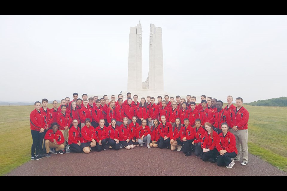 The youth who were part of the Maple Leaf Exchange stand at the Vimy Ridge Memorial in France. Photo submitted