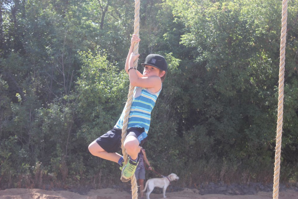 Tyce Chappel climbs a rope during the grand opening
