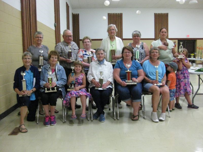 Winners of trophies at the Norquay Horticulture Show on August 16, from left, were: (back row) Marlene Jacquemart, Derek Howard, Delphine Howard, Mary Dyck, Cindee Danielson and Amanda Holinaty (with future horticulturalists), and (front) Deshan Kortello, Olga Moroz, Emmarie Holinaty, Mary Knutson, Jacqueline Ginetz and Iris Grywacheski.