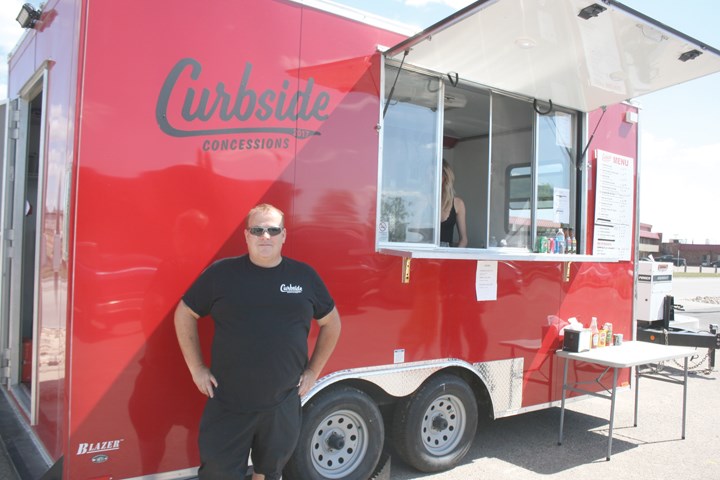 Dereyk Neudorf poses in front of his food truck, the first of its kind in Yorkton.