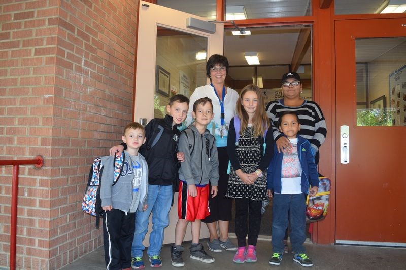 On Tuesday morning, which was the first day of school of the 2017-2018 term for students of the Good Spirit School Division, Kari Thomas (back, centre), welcomed students and family members to the Victoria School in Kamsack. With her, from left, were: Colton Lorenzo, who was entering Kindergarten; Parker Lorenzo, Grade 4; Jackson Gareau, Grade 4; Shayla Allard, Grade 3, and Joel Moore, Greade 1, with his mother Nadine Moore.