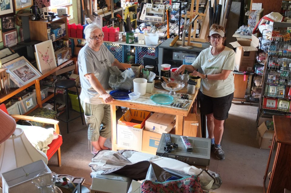 ReStore volunteer manager Kathy McCormick and volunteer Wendy Weseen at the store's new location.