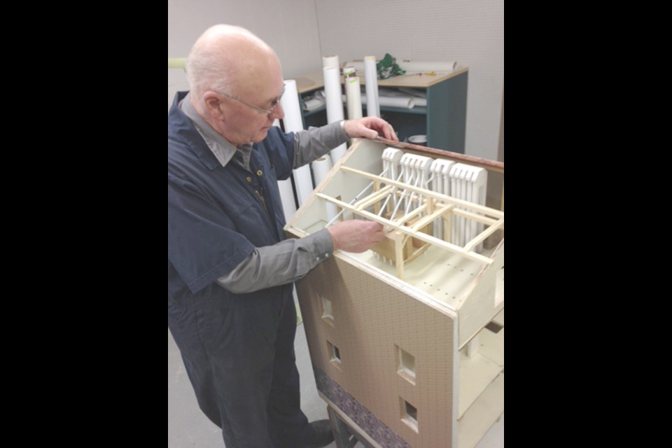 Yorkton's Vern Brown with a model of the old mill