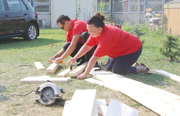 Volunteers from the Painted Hand Casino were doing a bit of building in the community, putting together picnic tables and a play house for the SIGN Early Learning Centre. The project was part of the Saskatchewan Indian Gaming Authority’s (SIGA) Day of Sharing program, where volunteers from each of their six casinos volunteered in the community.