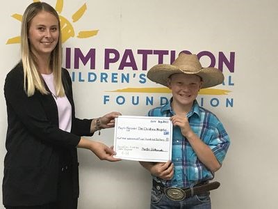 Porter Wolkowski, 11, of Canora donated $500 from the sale of his 4-H steer to the Jim Pattison Children’s Hospital Foundation in Saskatoon on August 31. Accepting the donation for the foundation was Jana Len.