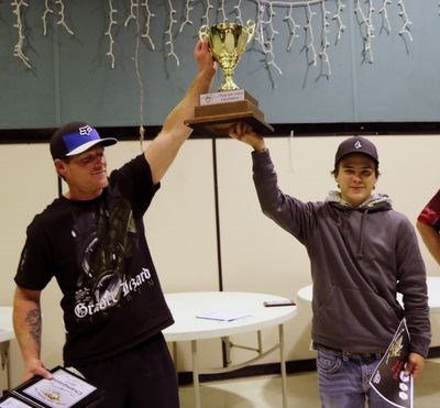 The 2017 Madge Lake Walleye Cup champions are Derek Prokopiw, left, and Dyllan Kowalski. At back is Al Parenteau of Minnedosa, Man., the emcee.