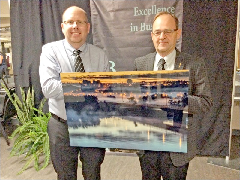Business of the Year was presented by Battlefords MLA Herb Cox on behalf of SaskTel, to Steven Ulven of Ilta Grain, Inc. Photos by John Cairns