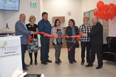 Deirdre Shingoose, a student at the Kamsack branch of Parkland College, cut a ribbon September 28 to mark the grand opening of the new College facility in Kamsack. Holding the ribbon, from left, were: Terry Dennis, Canora-Pelly MLA; Sally Bishop, board member: Leonard Keshane; board member; Shingoose; Lydia Cyr, board chair; Kamsack Mayor Nancy Brunt, and Dwayne Reeve, Parkland College president.
