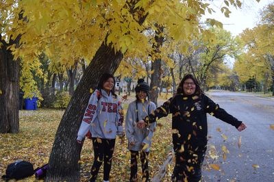 If anyone wonders why this time of year is often referred to as the “fall,” one need only take a peek outside and marvel at all of the leaves now falling to the ground. Enjoying themselves among the autumn leaves in Kamsack one afternoon last week, from left, were: Sage Tourangeau, Aaron Quewezance and Ebony Whitehawk.