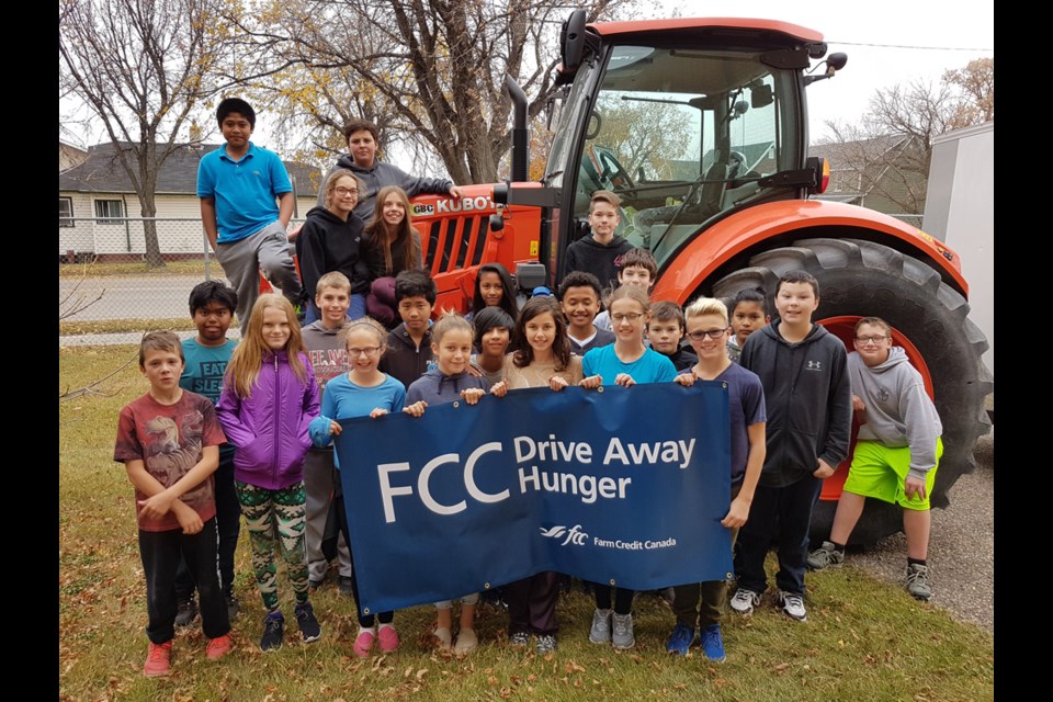 All the students of St. Dominic School, Humboldt Public School Student Leadership Council, and the St. Augustine grade 7 class hauled their food donations to the tractor and trailer during the FCC Drive Away Hunger event. Members from FCC Humboldt visited all the local elementary schools with Humboldt being one of ten stops on the FCC tractor tour across Canada for the Drive Away Hunger campaign. Together with a few local businesses, this year’s campaign collected 13,895 meals for the Humboldt and District Food Bank as well as 1,600 meals to be delivered to food banks in Watrous, Wadena, and Wynyard.