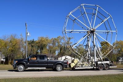 Canora residents saw an unusual sight on October 6 when a ferris wheel was moved from its long-time home at the east end of Barschel Avenue to the Huebert property at the south end of Canora.